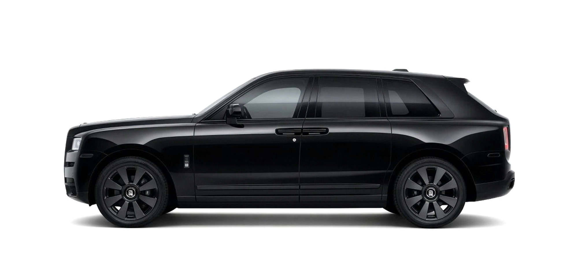 A black Rolls-Royce Cullinan, side on